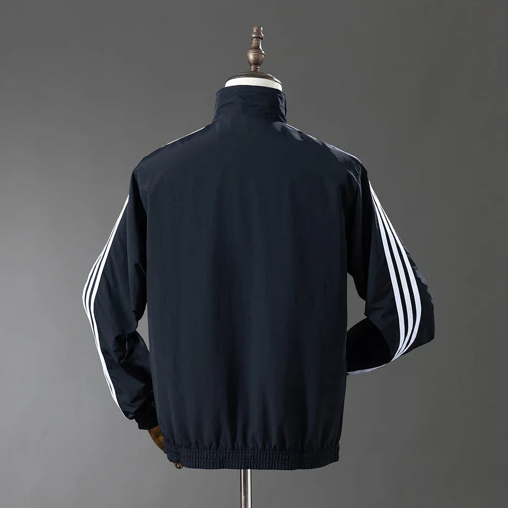 CORTAVIENTO ALEMANIA Il REVERSIBLE 2025 - ZonaCamisetas