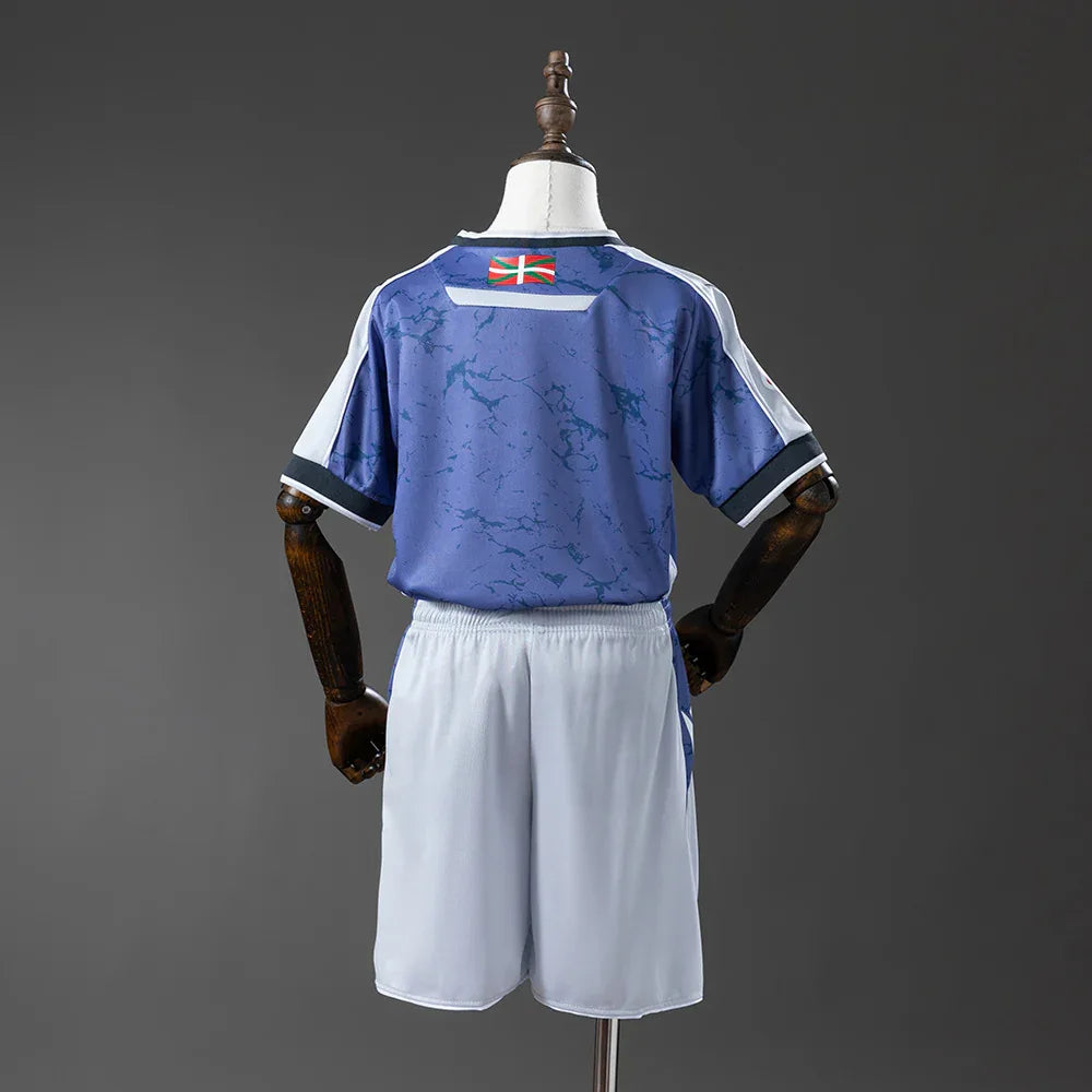 CAMISETA REAL SOCIEDAD I 25/26 CONJUNTO INFANTIL - ZonaCamisetas