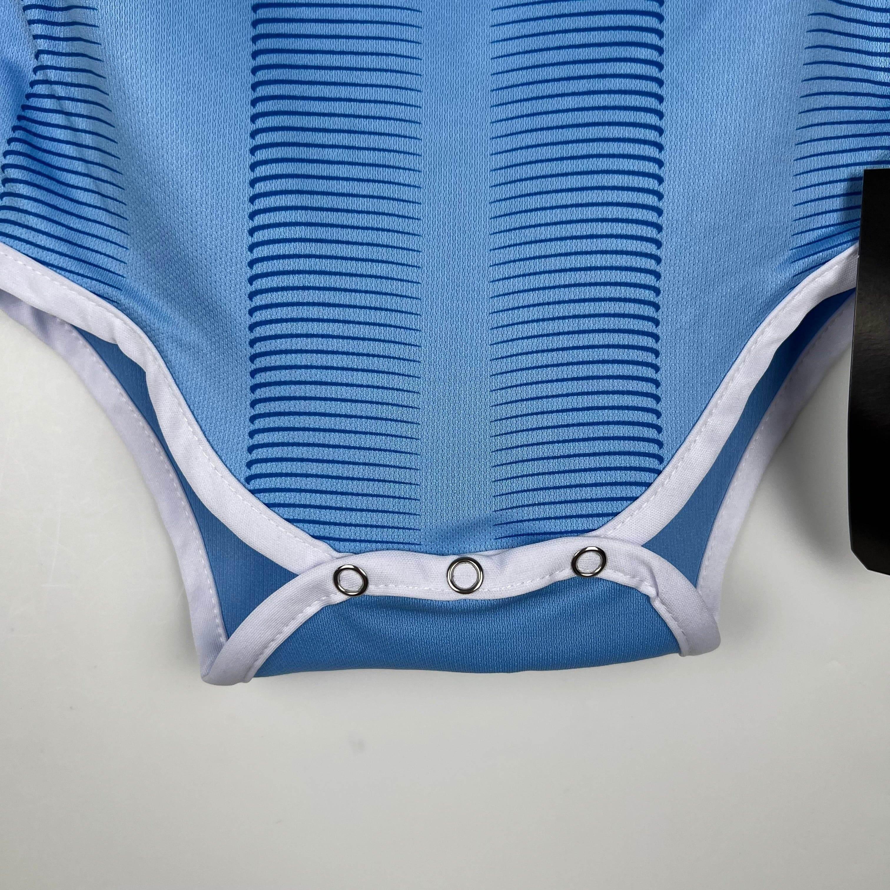 MANCHESTER CITY I 23/24 BEBÉ - ZonaCamisetas